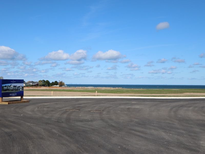Land being prepped for development with sign.