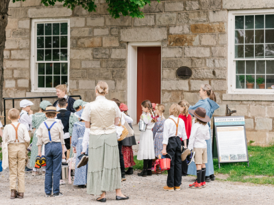 School children and teachers outside of Lincoln's Schoolhouse.